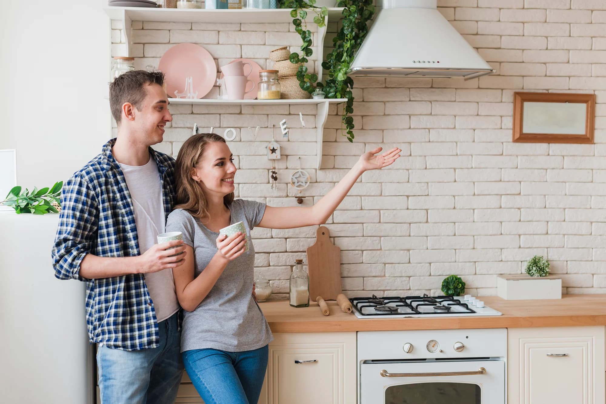 Couple in a modern kitchen discussing their home